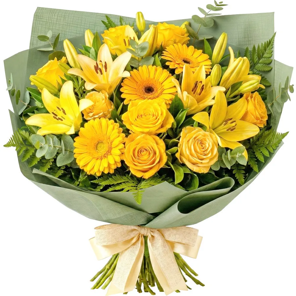 A "Sunny Cup" flower bouquet composed of yellow lilies, gerberas and roses, decorated with green eucalyptus and fern leaves, wrapped in green paper with a cream bow.