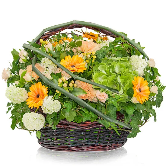 Tropical composition, composition of flowers in wicker basket, composition of orange and green, twig roses, gypsophila 