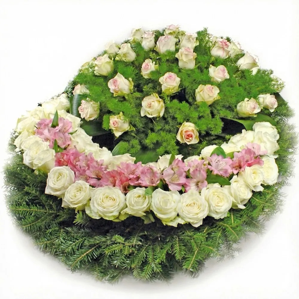wreath memories, funeral wreath with white roses, decorative greenery, and a base of conifer branches