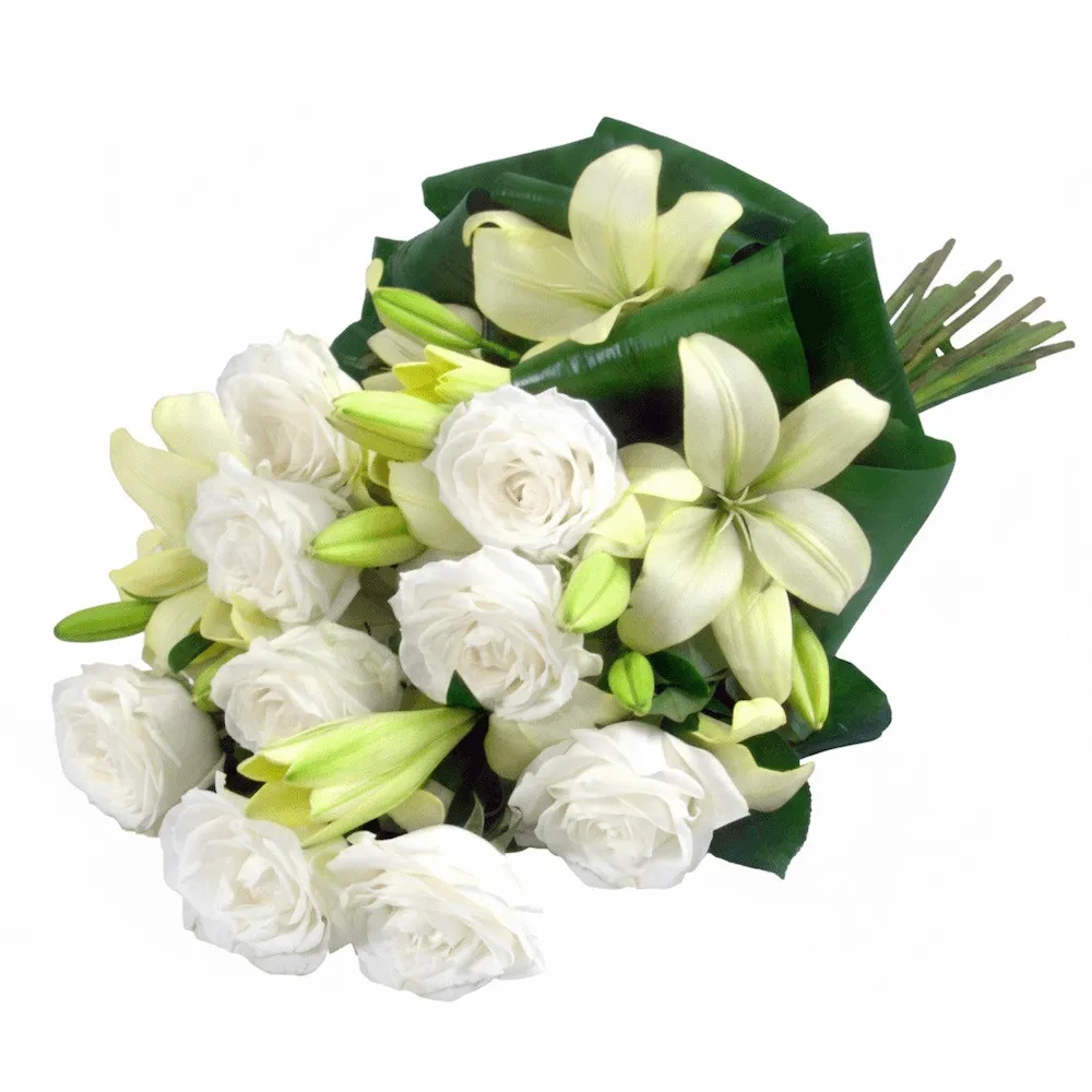 Flowers Delicate white wreath of condolences, white roses and lilies in funeral wreath 