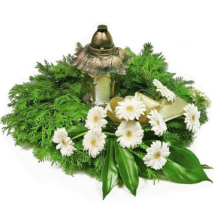 Gerberas and a candle in a fir wreath is a beautiful way to say goodbye. Order flowers online.