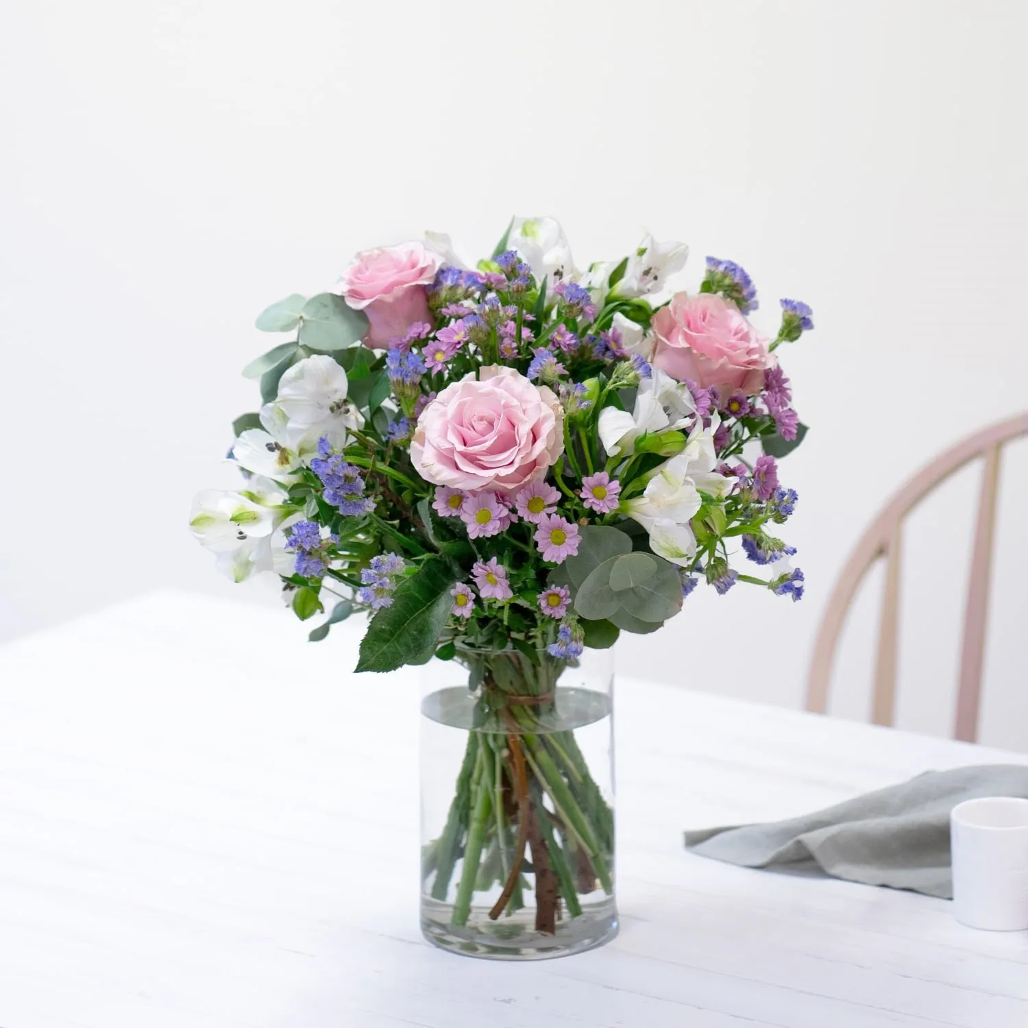 Bouquet of roses and mixed flowers with decorative greenery - Spain