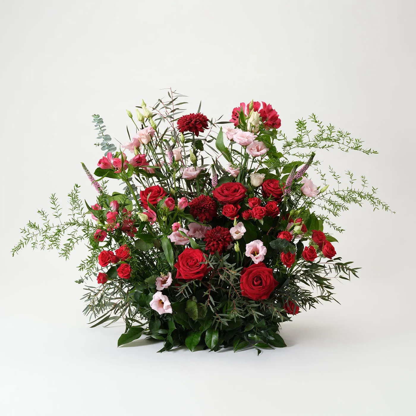 High funeral arrangement in red and pink - Sweden