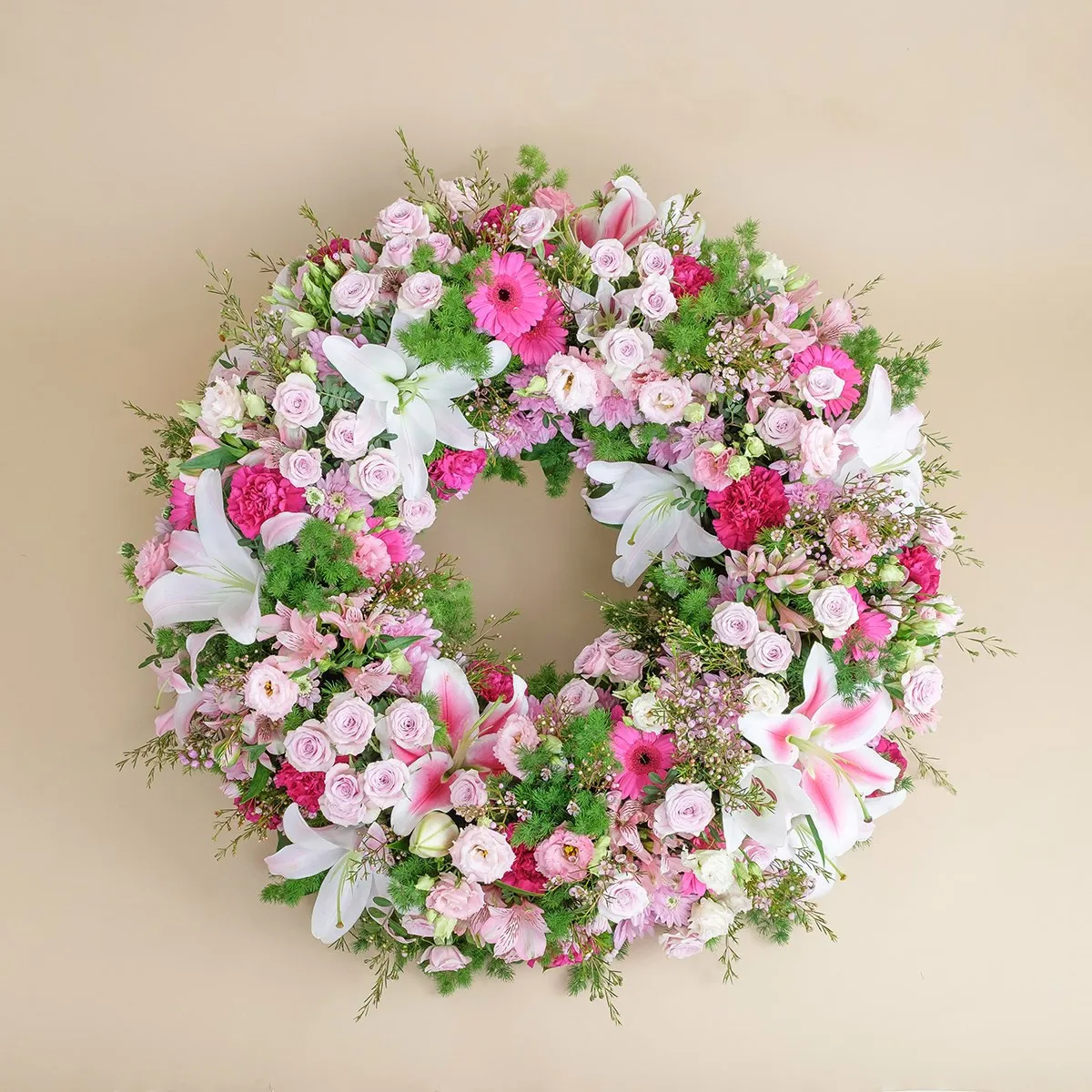 Small premium funeral wreath in shades of pink - Spain