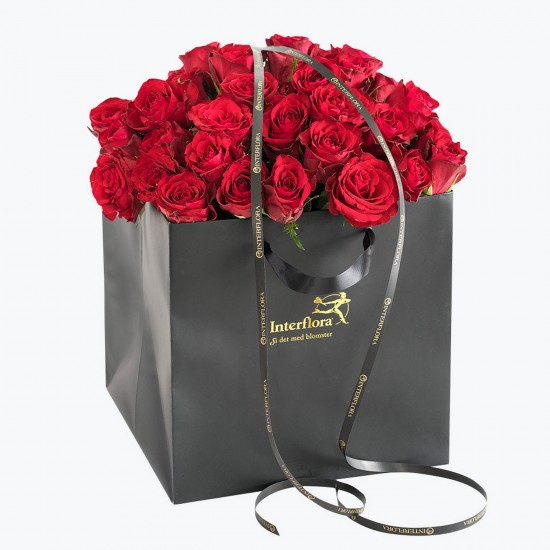 Red Roses In A Gift Bag