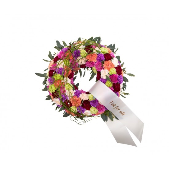 Round decorated wreath with ribbon