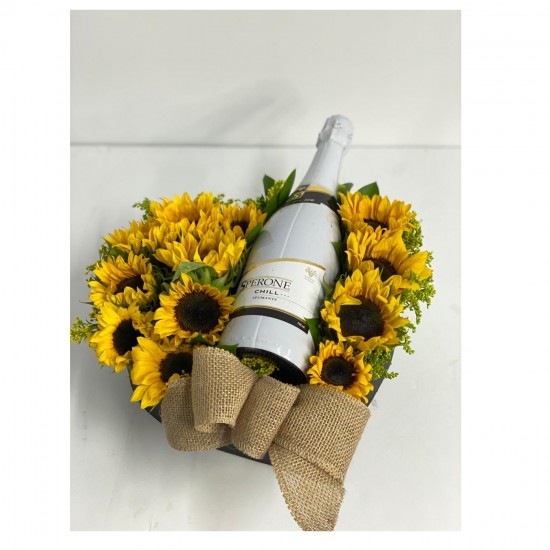Sunflowers in a box with wine