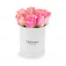 Pink roses in a white box
