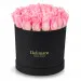 Pink roses in a black box