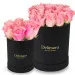 Pink roses in a black box