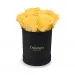 Yellow roses in a black box