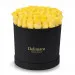 Yellow roses in a black box