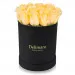 Yellow roses in a black box