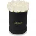 White roses in a black box