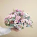 Funeral centrepiece in pink tones