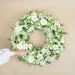 Funeral wreath with roses and gerberas