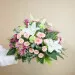 Funeral composition in delicate pink tones