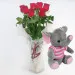 7 red roses with pink elephant