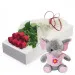 7 red roses with pink elephant