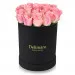 Pink roses in a black box