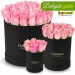 Pink roses in a black box