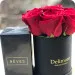 Czerwone róże w czarnym pudełku z perfumami Rêves