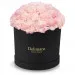 Pink carnations in a black box