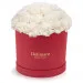 White carnations in a red box