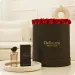 Red roses in a black box with Rêves perfume 