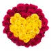 Red and yellow roses heart shaped in a black box