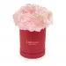 Pink carnations in a red box