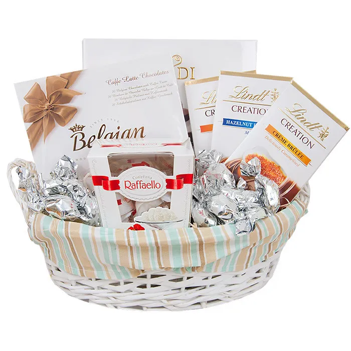 Silver basket, basket full of plums in chocolate, basket with chocolates and reefaello