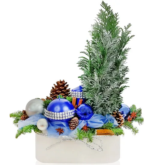 Centrepiece Haberdashery, cypress, cones, fir branches, cinnamon, candles, organza baubles in a ceramic pot, holiday reeds