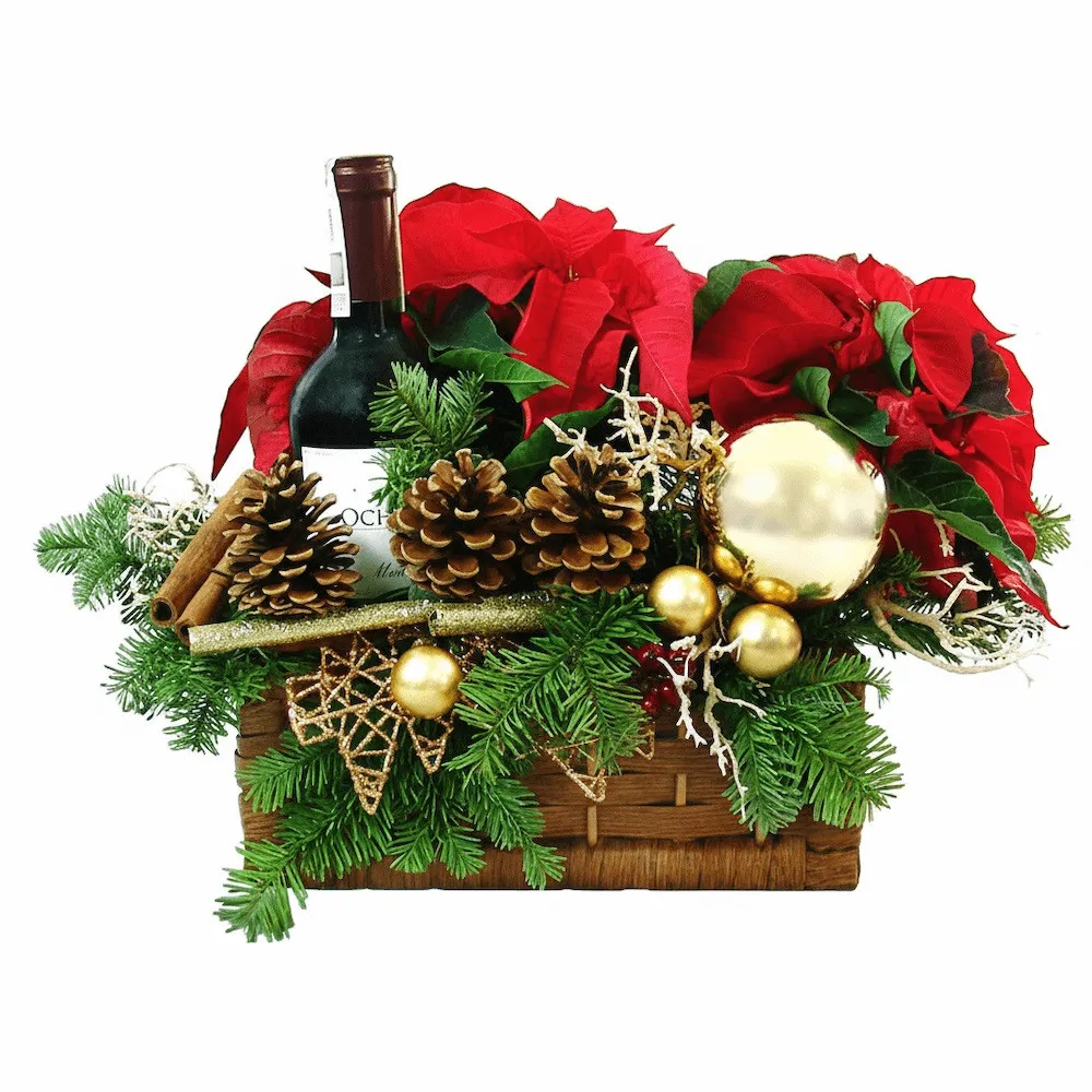 Warming centrepiece, poinsettia, cinnamon, cones, fir branches, candles, baubles, rosehip, wine in a box, reeds as a gift