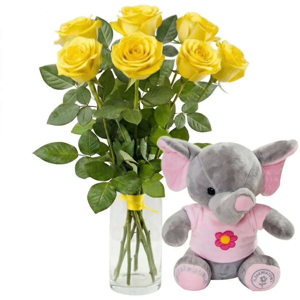 An elephant and a bouquet of seven rich yellow roses in a simple, clear glass vase, tied with a yellow ribbon, presented on a plain white background.