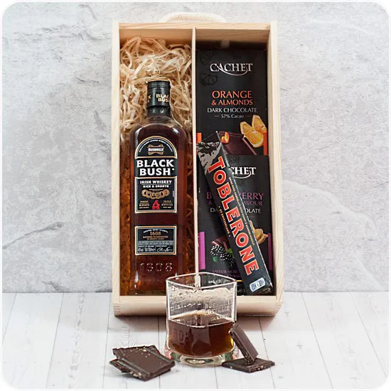Wooden  gift box with a set of unique products with whiskey, chocolates and toblerone good for him