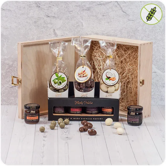 Sweet sensations, chocolate balls, honey with juices, sweets in a wooden box