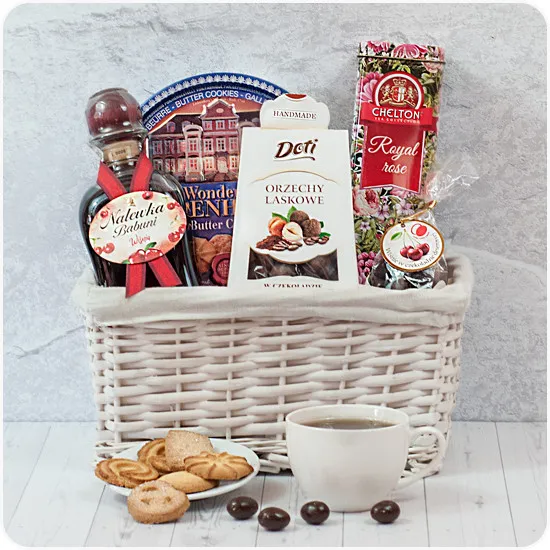 Grandma's basket, a bright basket with granny's tincture and tea, cherries in chocolate, hazelnuts in chocolate