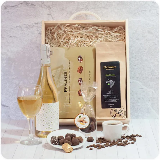 A golden box, a wooden gift box with white wine and coffee beans, ginger in chocolate