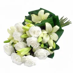 Flowers Delicate white wreath of condolences, white roses and lilies in funeral wreath 