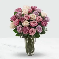 24 pink and purple roses in a vase. - Zambia