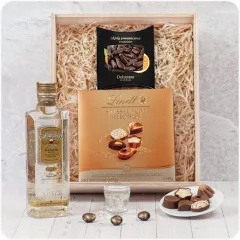 Engraved wooden gift box with Goldwasser, chocolate with gold particles and lindt pralines