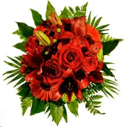 Round bouquet of seasonal flowers in RED shades (roses, gerberas, lilies etc..)