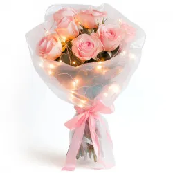 Bouquet of pink roses with lights