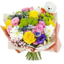 Colorful bouquet with a teddy bear