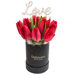 Red tulips in a black box
